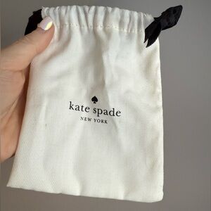 Kate Spade Ivory Pouch with Black Ribbon